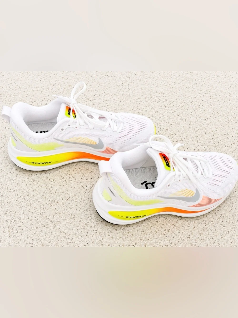 Nike White Volmero 18 Running Shoes with Neon Yellow-Orange Accent